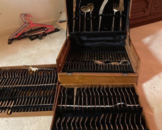 Tommy Gem MCM Thai Bronze flatware (156 pieces) in Teak box.                $150.00