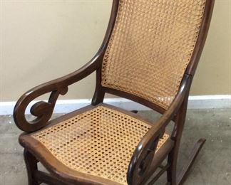 ANTIQUE CANED LINCOLN ROCKING CHAIR