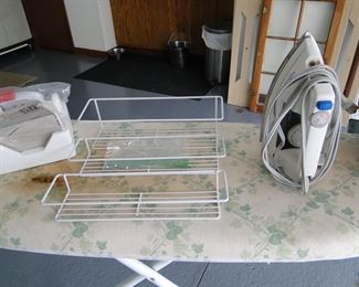 Iron, ironing board, and spice rack