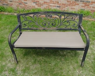 Solid metal bench, complete with cushion