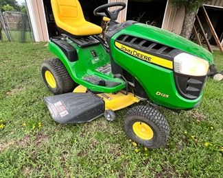 John Deer D125 ride-on tractor / mower with 42” deck. Literally like new. Starts first crank every time & has hour meter shows 4.5 hours!!! Even has headlights! More pics later…