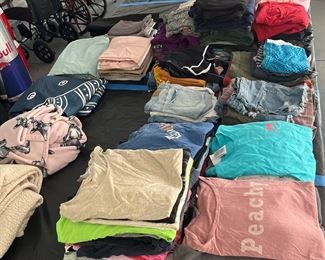 Tables full of men's - ladies and teen clothes