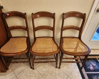 4 cane bottom chairs 1 needs to be repaired.