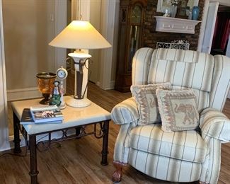 This overstuffed chair has a secret!!! It is really a Lazy Boy recliner.