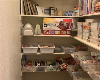 The top row of this closet has some great picture frames. The rest of this treasure chest is full of scrapbooking supplies and tools to make amazing cards and scrapbooks.