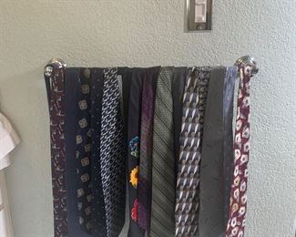 There is a large selection of ties to choose from.