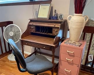 Small roll top desk, Office chairs, pink file cabinet, oscillating floor fan