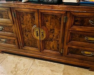 Asian inspired dresser with brass accents