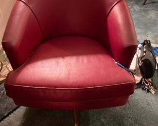 One of a Pair of Red Swivel Chairs 