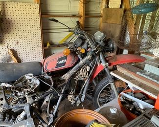 Small metal building outside behind the house