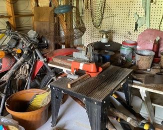 Small metal building outside behind the house
