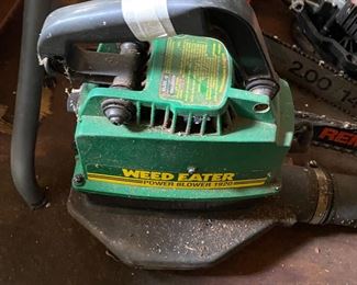 Small metal building outside behind the house