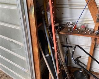 Small metal building outside behind the house