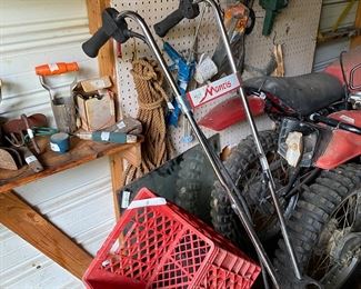 Small metal building outside behind the house