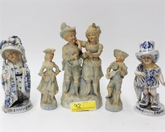 92: Porcelain and bisue figurine grouping