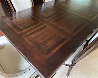 F7 - $850. Universal Furniture table with 8 chairs. Measures 45” wide x 101” long (with 20” leaf in place) x 30.5” tall.  Has table pads to protect the 2. 2 captains chairs and 6 regular. Table & Chairs are in excellent condition. 