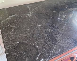 F9 - $350. Universal Furniture measures 17.25” deep x 63” long x 36.5” tall. Metal base with stone top. 