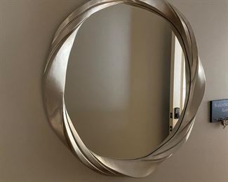 F11 - $30 round silver mirror. Measures 34” round. 