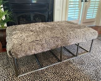 F16 - $225. Rachel Ray Home faux fur ottoman. Measures 35” wide x 53” long x 17” tall. 