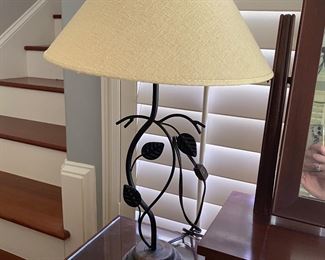 L4 - $15. Wooden bags with iron leaf design. Measures 22” tall. 