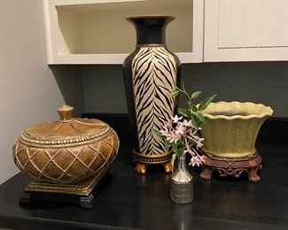 Left to right $15, $40 Carolyn Kinder zebra vase,  $3 silver vase, $8 decorative planter