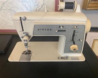 $40. Singer sewing machine in case. Measures 18" x 36" x 29" tall. 