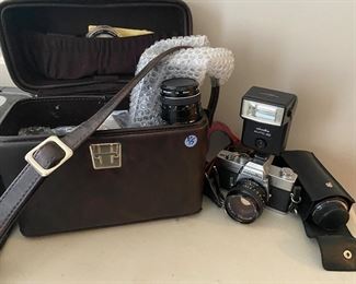 $75. Minolta Camera with several lenses and case. 