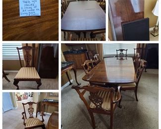 Dining table with eight chairs includes two leaves and protective pads