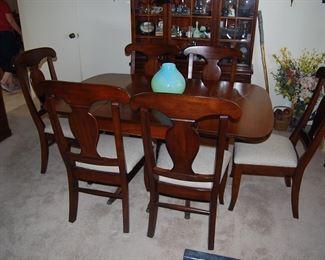 DROP LEAF DINING TABLE, WITH ADDITIONAL LEAF AND PADS.  COORDINATING BUFFET AND CHINA CABINET.  