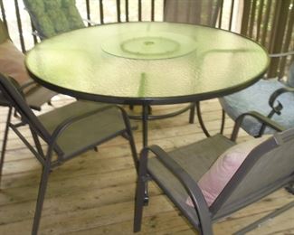 4 Ft round glass top table w/lazy Susan and 4 matching chairs 