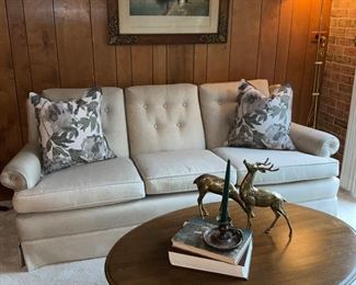 Custom, upholstered, sofa, oval coffee table, brass deer