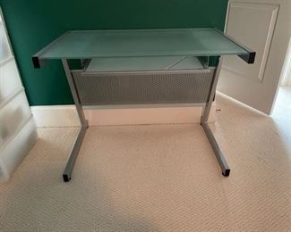 $150 USD      Frosted Glass Top Gray Metal Base Contemporary Computer Desk SB183-43    Description: It features a minimalist gray metal frame and metal wire  with a frosted glass surface (with a sea green tint) for a modern aesthetic.

Dimensions: 37 x 24 x 38"H

Condition: Very good condition

Local pick up Chevy Chase, MD.  Located on second floor.  Contact us for shipper suggestions.     https://goodbyhello.com/products/desk-sb183-43?_pos=33&_sid=32be479f3&_ss=r