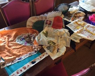 Scarfs and Souveniers collected by family on trips and while in service during World War II.                                           One item of interest is orange scarf on left / scarf purchased at Texas 1936 Dallas State Fair.  Scarf in need of repair on borders.