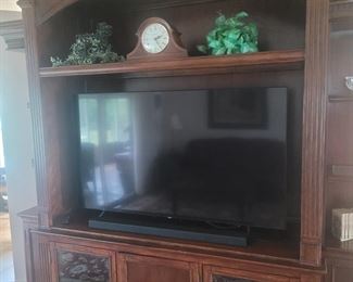 Television display center. There are a number of pieces that go with this piece. They can be bought individually if you want. Over eight foot tall