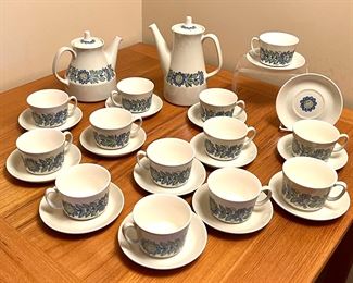 Vintage Figgjo Tor Viking Tea Service Set includes two teapots and 13 cups and saucers. Items are in vintage condition with some wear including crazing and one of the saucers has a chipped rim. 