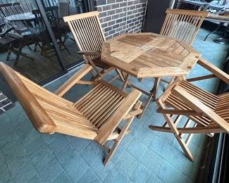 Vintage Teak Folding Table and Chairs Set in good condition with some stains/wear on the table top. This set folds up nicely for storage! 

The table measures 31" x 31" x 29" 