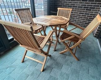 Vintage Teak Folding Table and Chairs Set in good condition with some stains/wear on the table top. This set folds up nicely for storage! 

The table measures 31" x 31" x 29" 