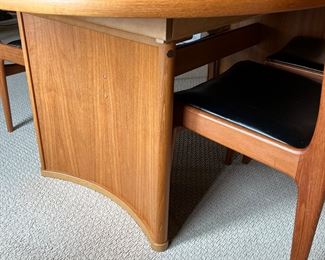 Danish Mid Century Modern Dining Room Table and Chairs. A truly lovely set in very good condition with light wear. As seen, the table measures 70.5" x 45" x 29.5" with two additional leaves stored under the table. 

Comes with six chairs featuring a lovely curved design and includes two host chairs. Looks to be by Skovby, however; no maker's mark was found. 