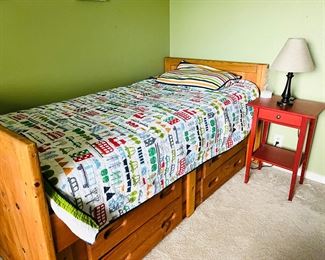 Twin bed with storage drawers. Solid wood. Side table and lamps.