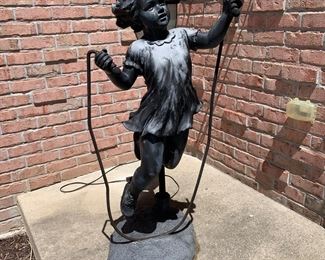 Girl skipping rope outdoor light