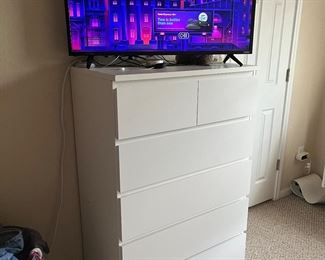 TV and tall boy dresser.