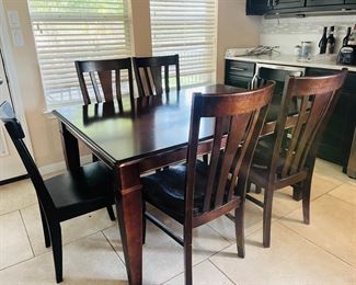 Kitchen table and chairs with leaves.
