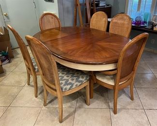 Vintage oval hardwood dining table with six chairs and removeable insert/leaf.