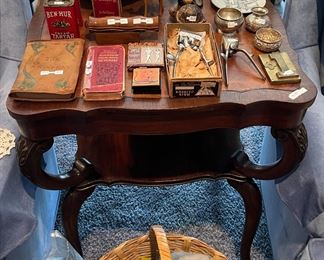 Hardwood table with leather insert top with antique and vintage items. stuffed swan & seal with tags