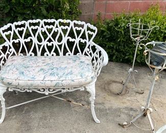 Vintage wrought iron loveseat with cushion, two plantstands & glass outdoor decoration