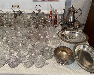 Antique condiment caddies, cruets, creamers silver tea set. pewter bowl & silver trays