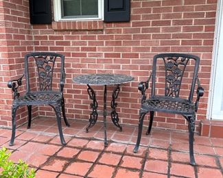 Cast aluminum chairs (20"W) and round table (27"H x 24"W) with roses pattern, some wear to paint