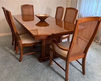 Broyhill dining table with paneled pedestal legs, 82"L with 18" leaf inserted, 40"W, tan upholstery with caned backs, minimal wear