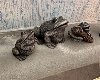 Three small grey resin frogs, largest is 2"H