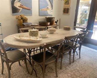 Attractive iron base dining table with distressed wooden top , 8 steel chairs 